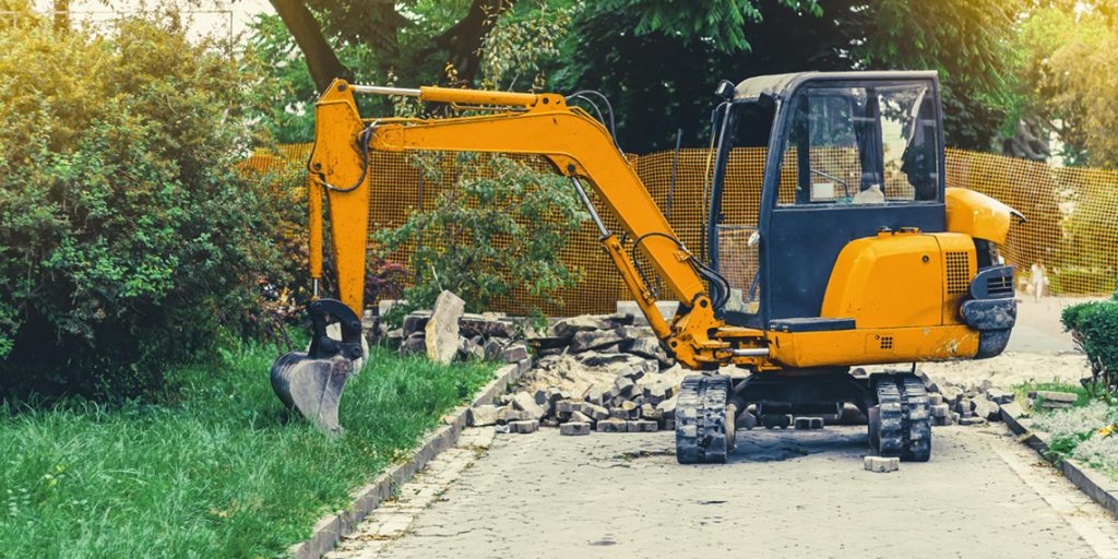 Construction excavator with operator demonstrating wet hire and dry hire equipment options in Sydney